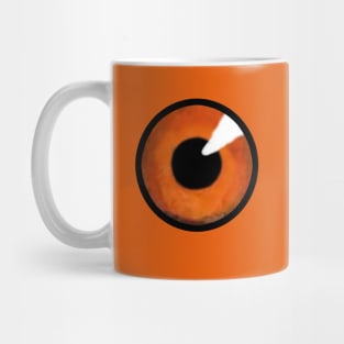 Orange iris of big eye, with black pupil staring. Mug